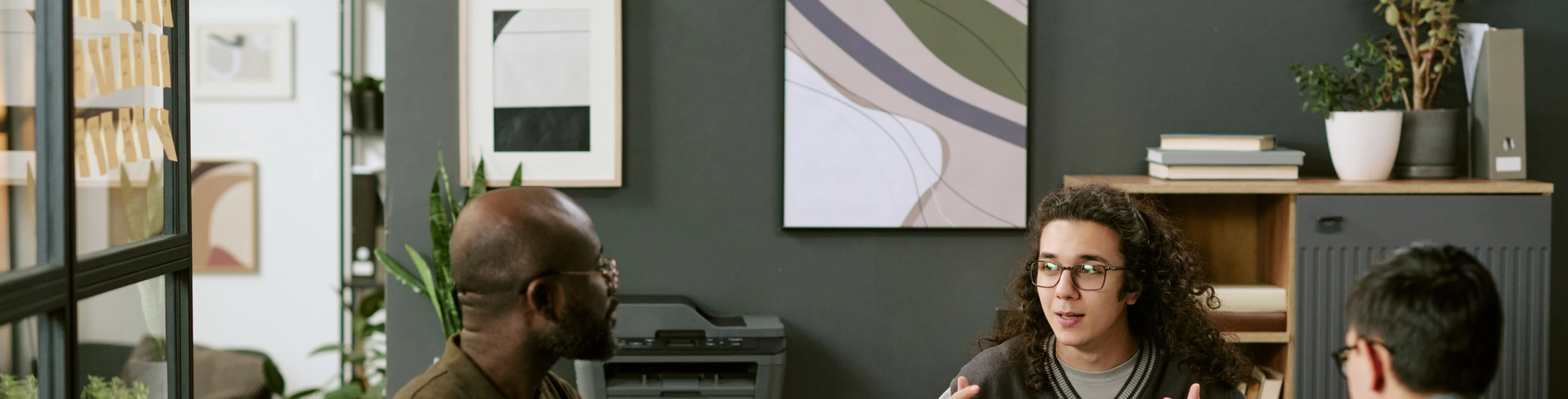 Professionals discussing a technology strategy in a meeting room.